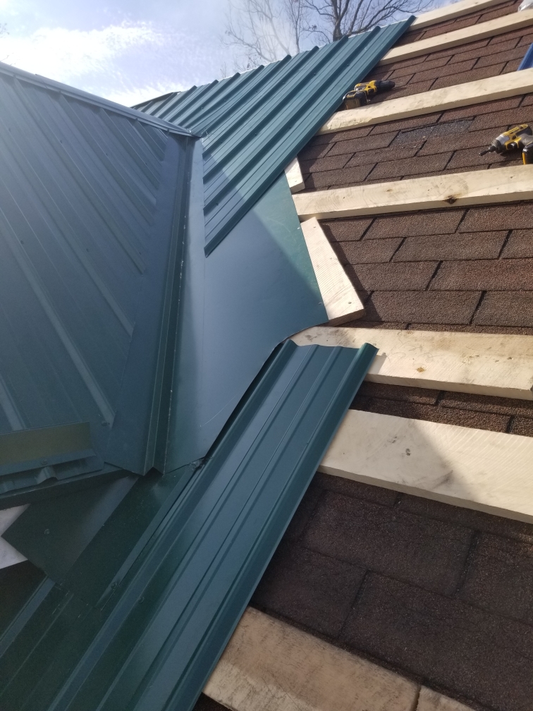Professional roofing team replacing old shingles with new, durable roofing materials on a suburban home