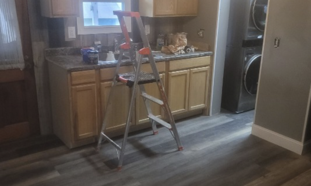 Sleek laminate flooring installation by Appalachian Contractors, combining modern style with durability.